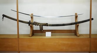 The Odachi Masayoshi forged by bladesmith Sanke Masayoshi, dated 1844. The blade length is 225.43 cm (88.75 in) and the tang is 92.41 cm (36.38 in).